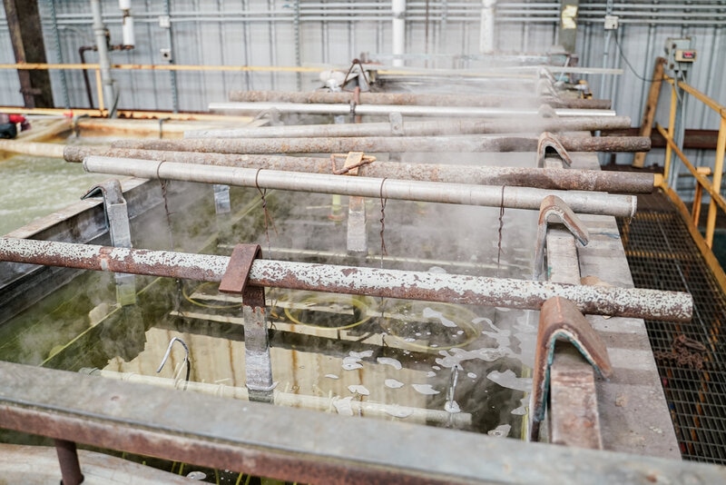 Shafts in a hard chrome plating tank at H&M Plating in Houston