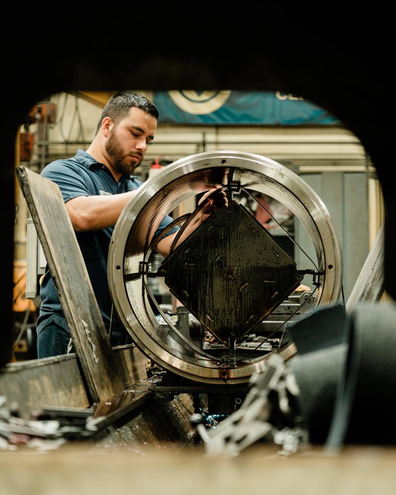 H&M Plating technician preparing a part